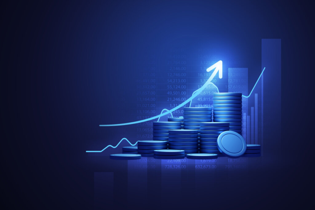 Uma imagem digital de moedas com uma seta indicando crescimento/aumento nas finanças