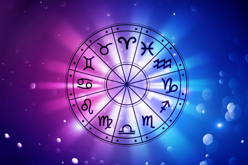 Círculo com os 12 signos do zodíaco com fundo rosa e azul