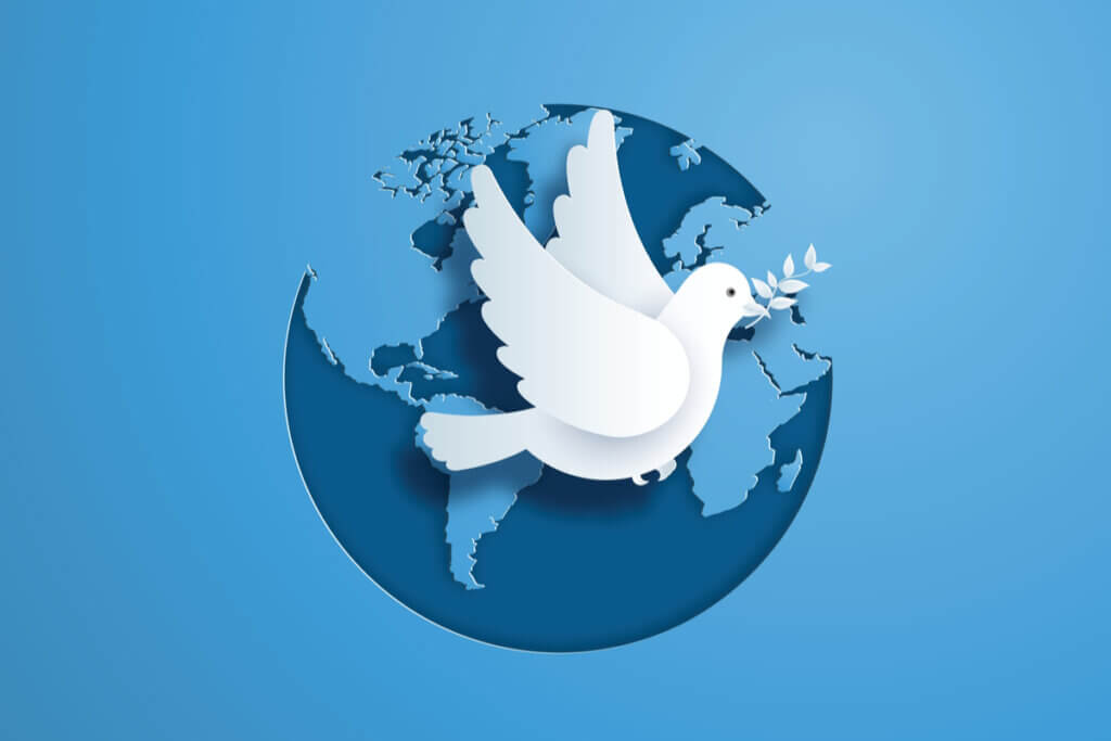 Ilustração de pomba branca sobre globo terrestre