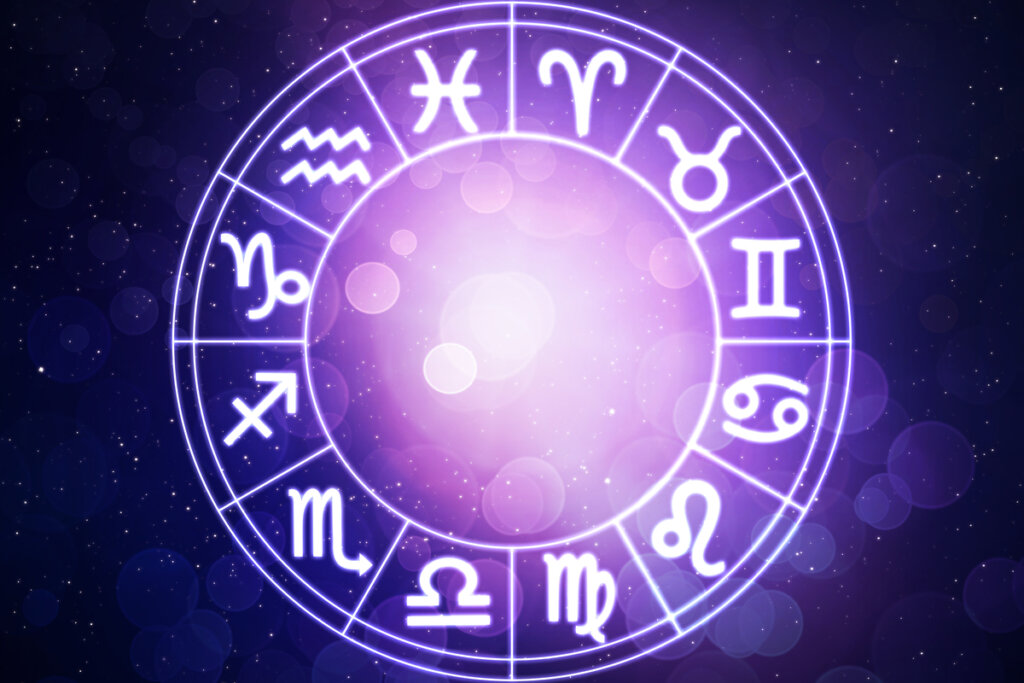 Círculo com os 12 signos do zodíaco no fundo roxo escuro