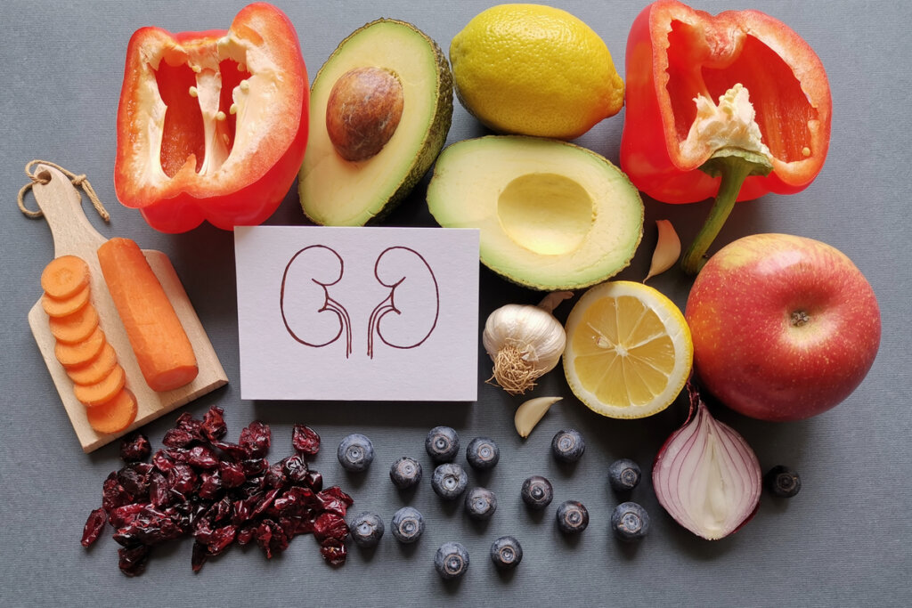 Foto com legumes e frutas e, em cima, o desenho de rins