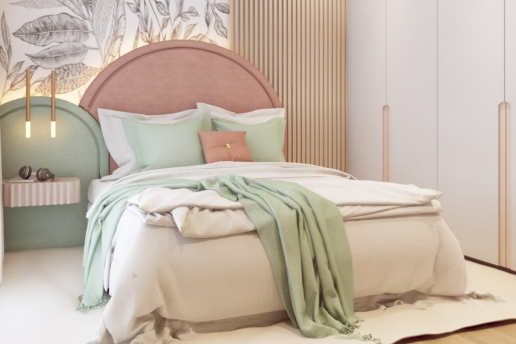 Quarto decorado com itens em tons de rosa e verde pastel com mantas e almofadas pela cama