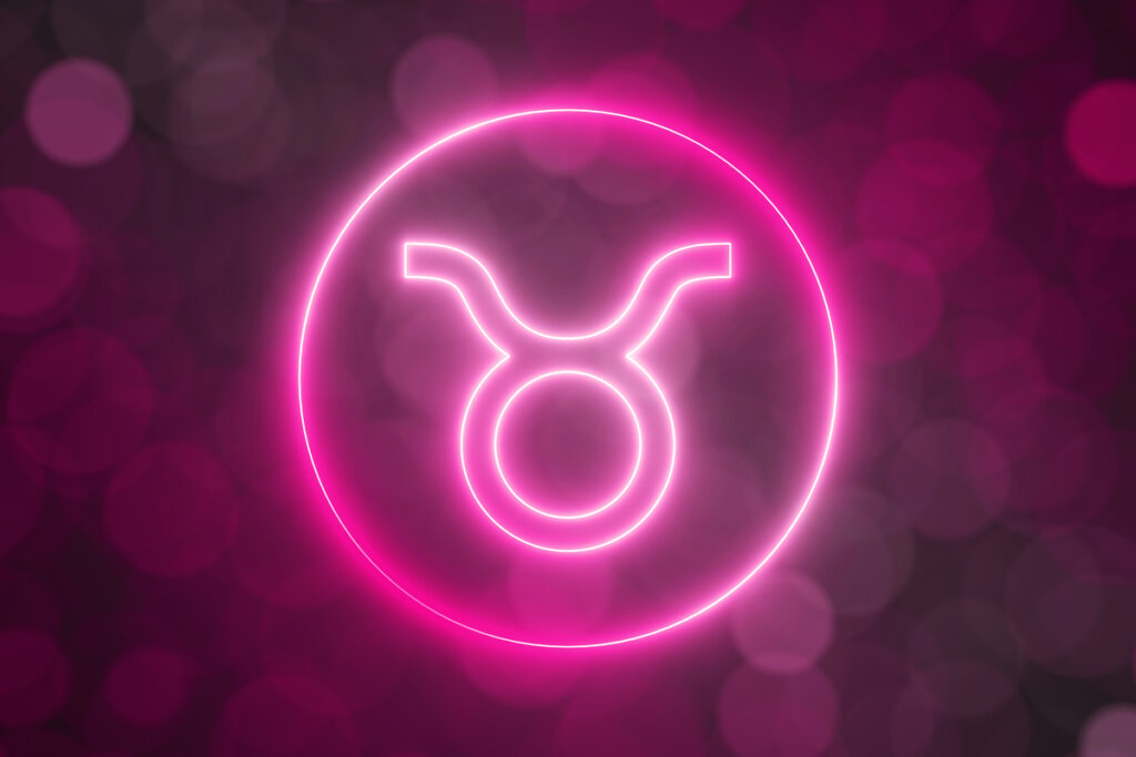 Ilustração do signo de Touro em um círculo com fundo rosa 