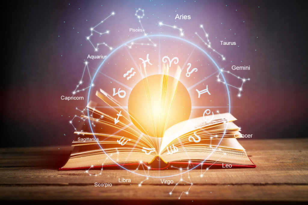 Conceito de leitura astrológica; Livro aberto com círculo do zodíaco