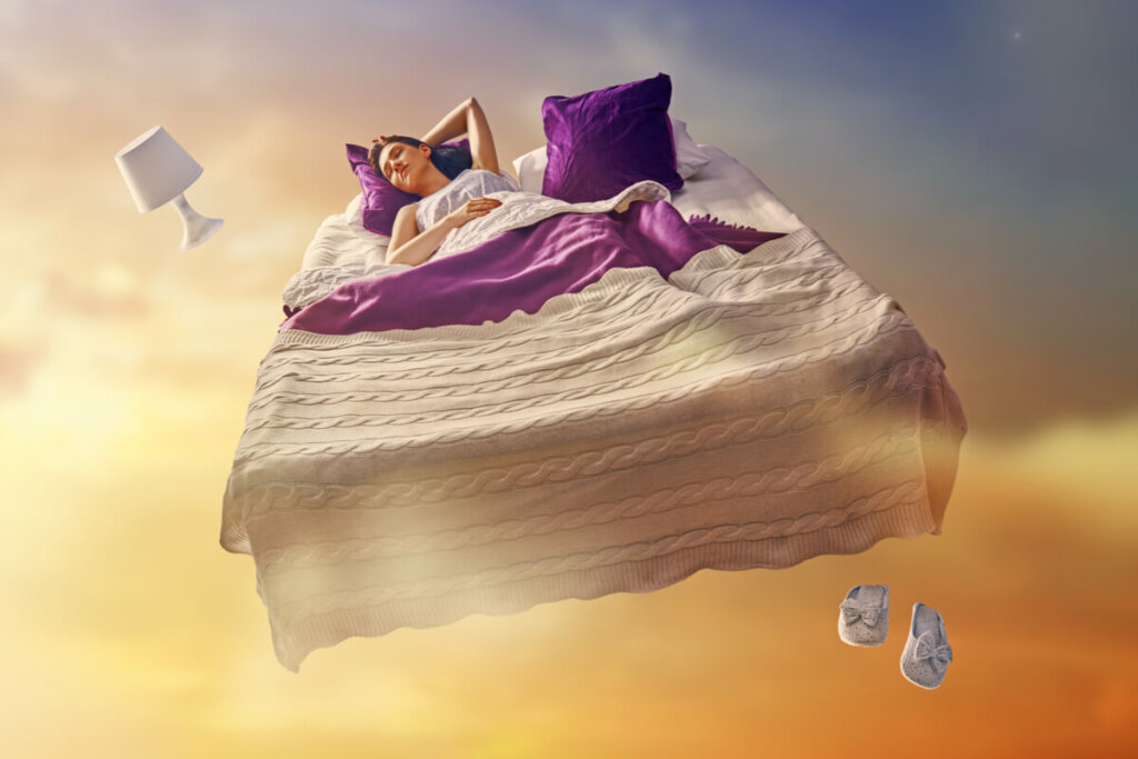 Mulher dormindo em uma cama flutuando no céu