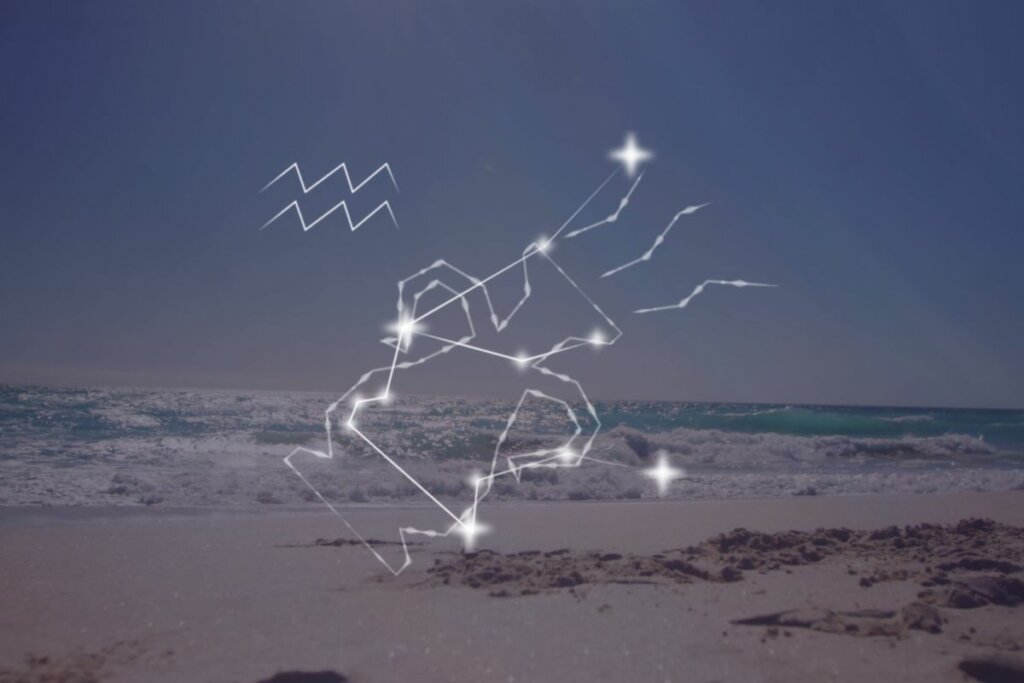 Ilustração da constelação de Aquário com a imagem de uma praia de fundo  