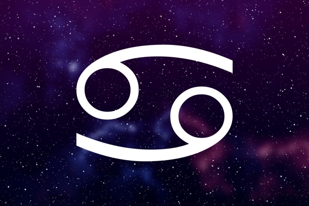 símbolo do signo de câncer em fundo com galáxia roxo