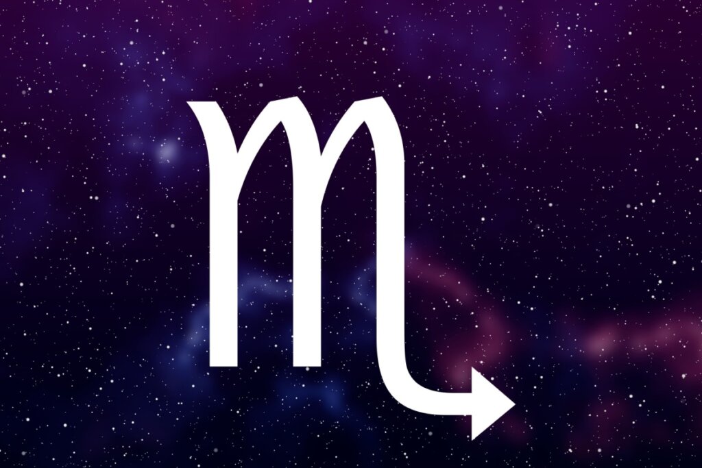 símbolo do signo de escorpião em fundo com galáxia roxo