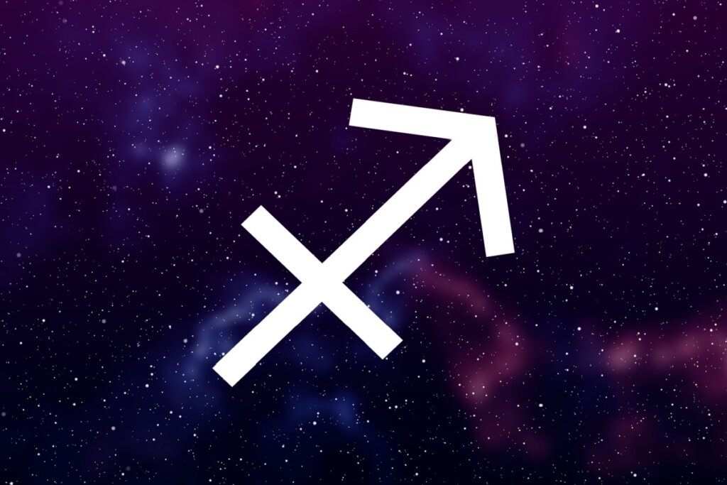 Símbolo de sagitário em branco com fundo roxo com estrelas