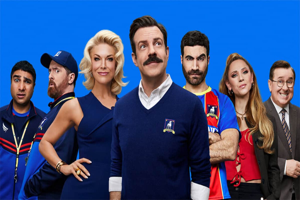 Sete personagens da série Ted Lasso em fundo azul 