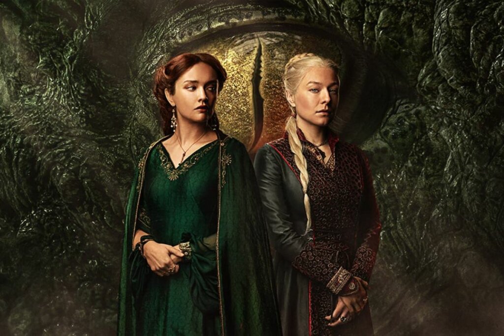 Emma D'Arcy e Olivia Cooke na capa da segunda temporada de "House Of The Dragon" uma ao lado da outra viadas de costas e com as mãos cruzadas