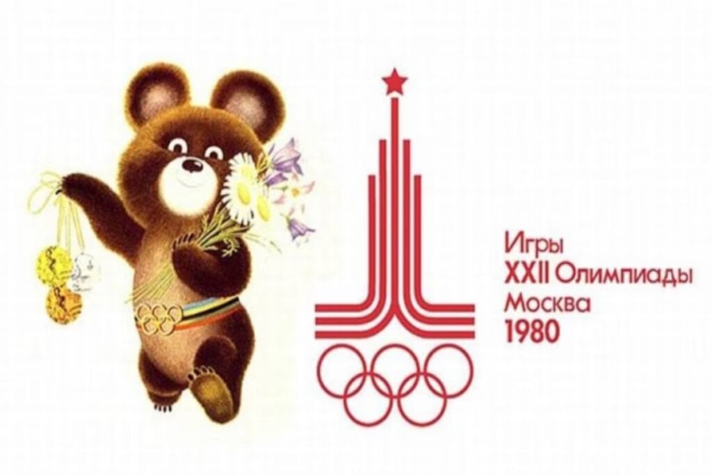 ilustração do urso Misha segurando flores e medalhas