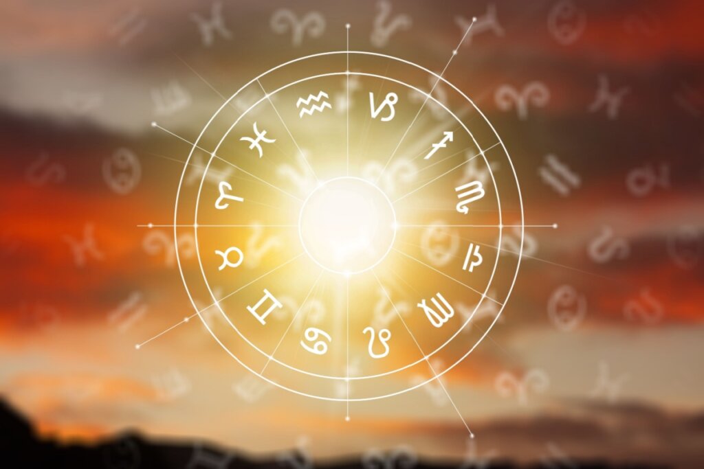 círculo branco com símbolo dos 12 signos em volta e sol ao centro